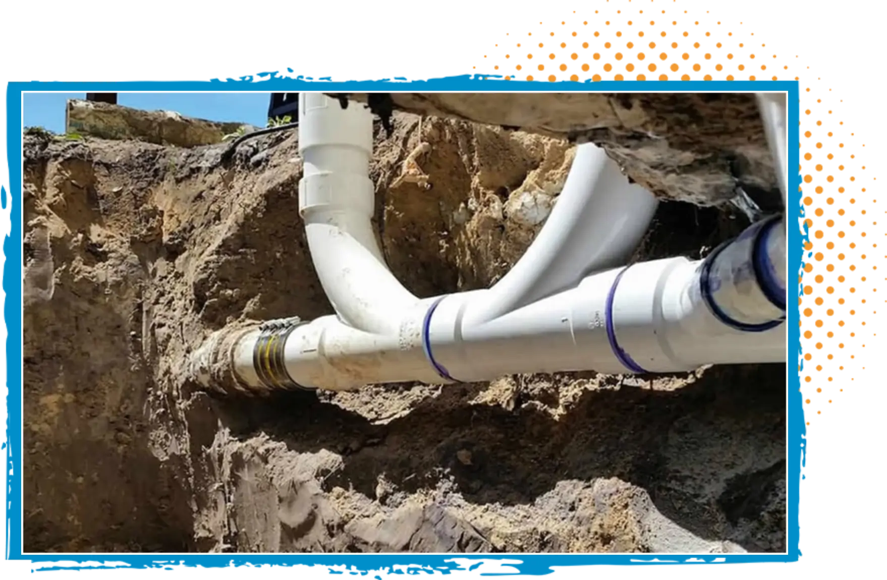 PVC pipes installed underground for plumbing systems in a trench, showcasing professional plumbing work.