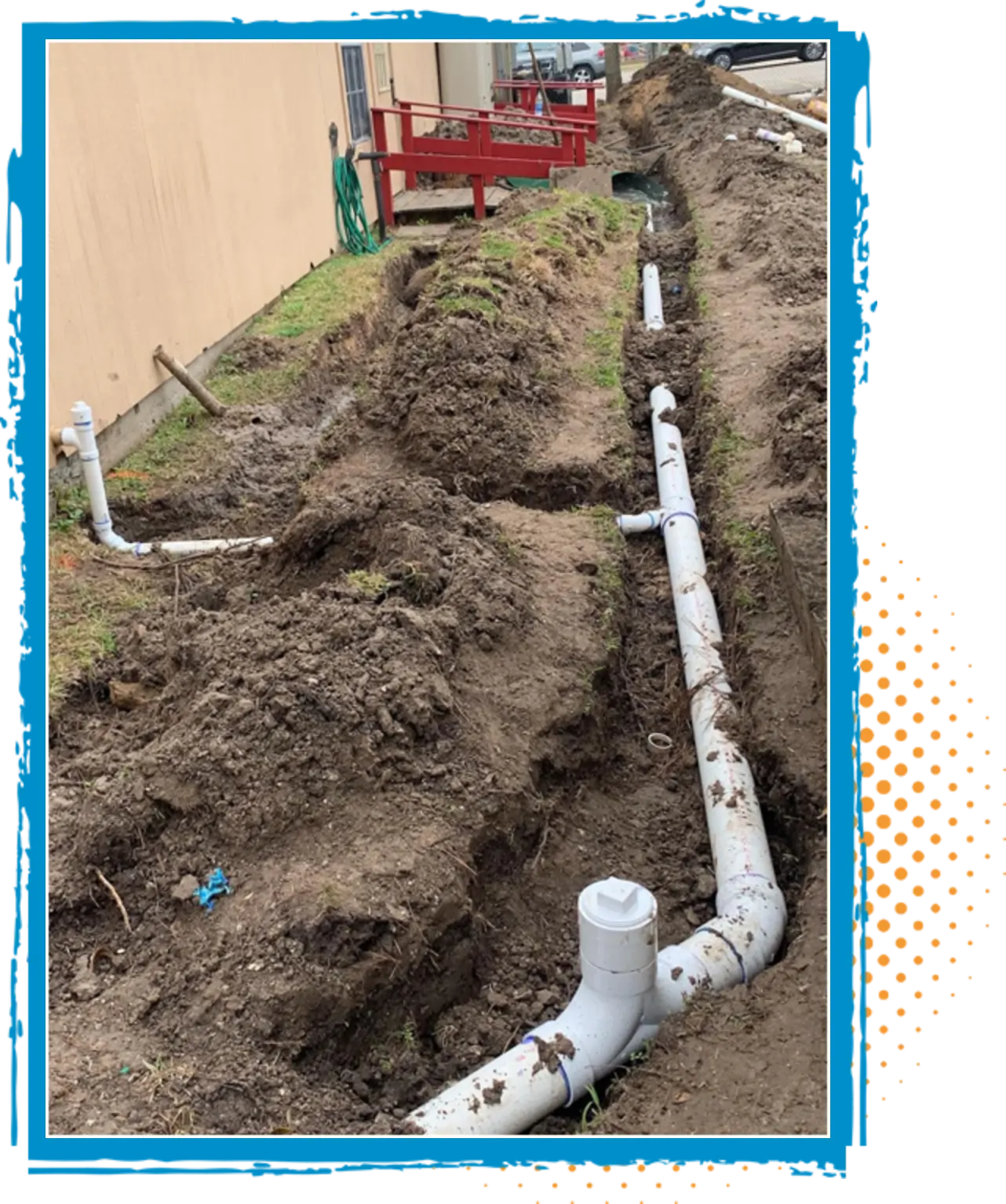 Excavated trench showing newly installed white PVC plumbing pipes, illustrating plumbing upgrades for improved water flow and drainage efficiency.